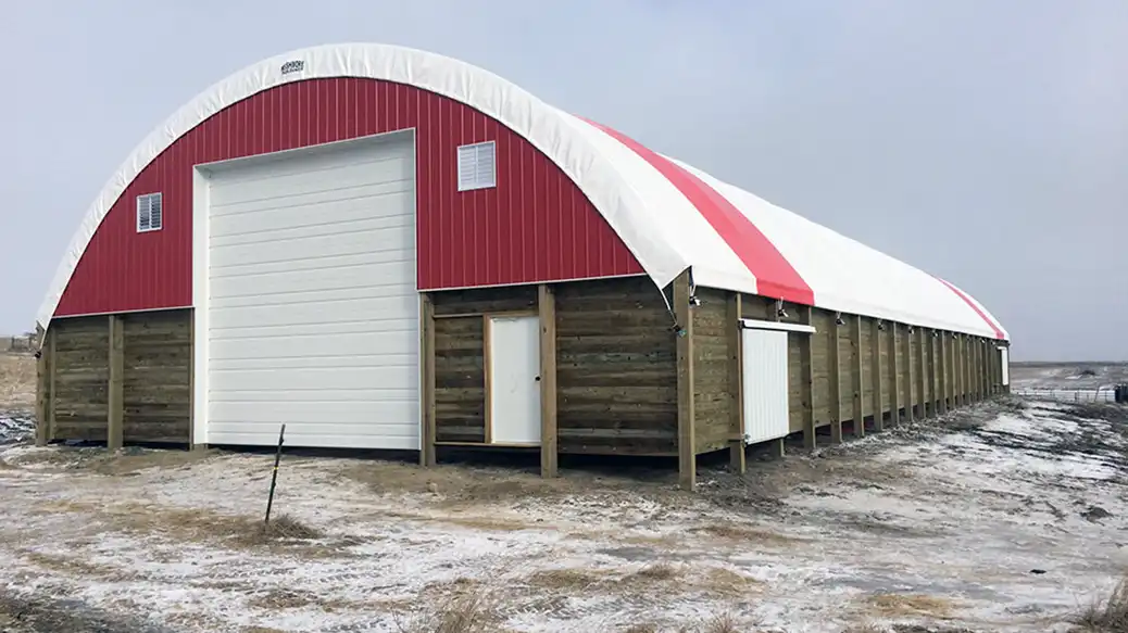 Rushmore hoop barn with a high ponywall and side doors in a field
