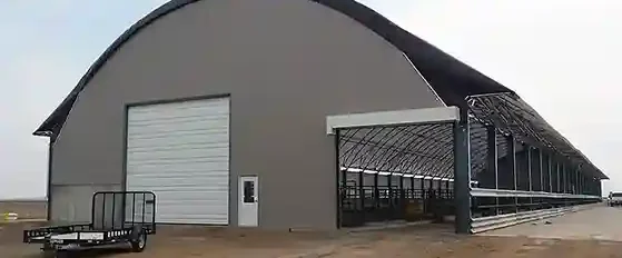 80 foot wide freestall dairy barn with both side feed awnings